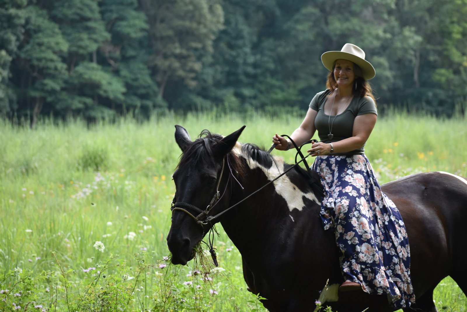 Allyson, maker and founder of Wild Riverbend Rustics, riding her horse