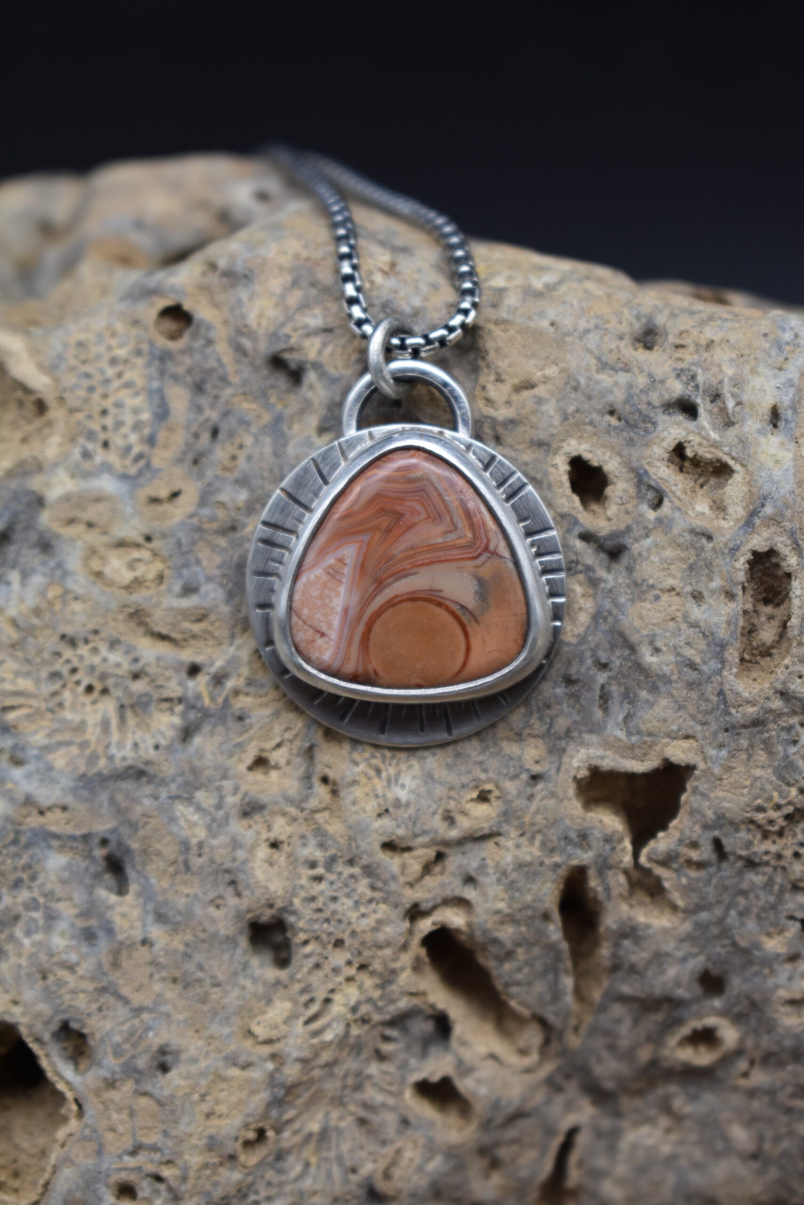 Orange Lake Superior agate set in sterling silver with a sunburst around the setting
