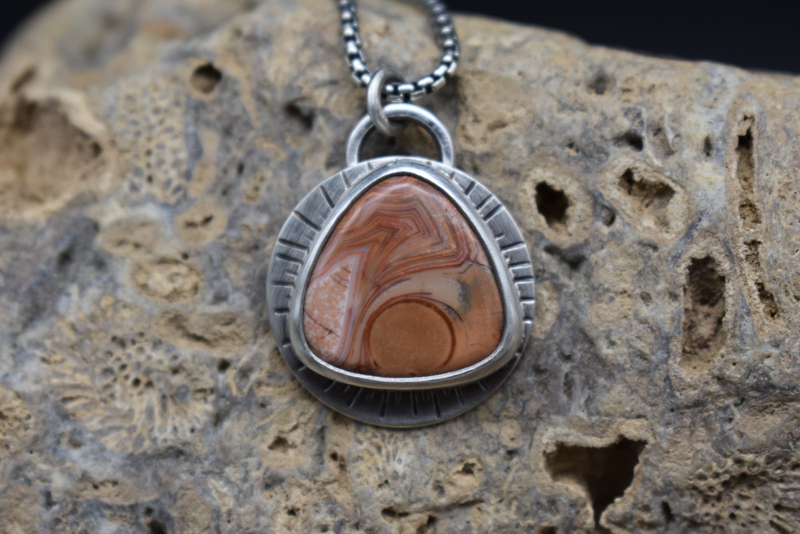 Orange Lake Superior agate set in sterling silver with a sunburst around the setting
