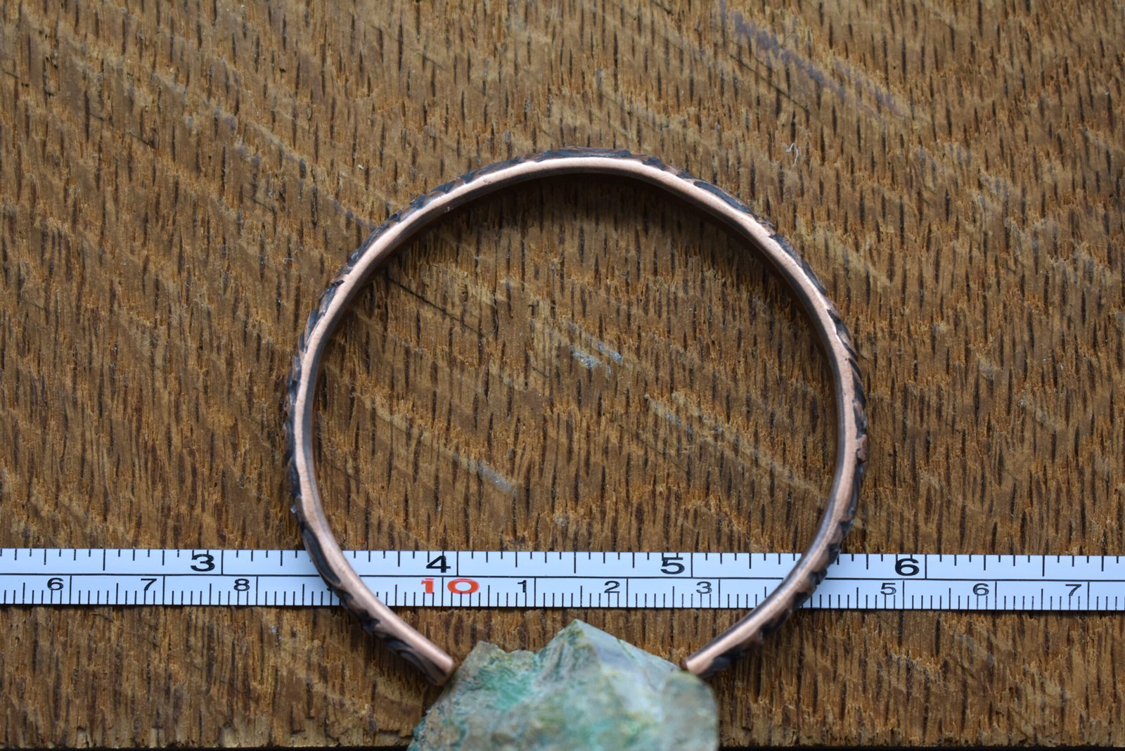 Handmade Copper Cuff Bracelet with a floral pattern and rustic patina finish