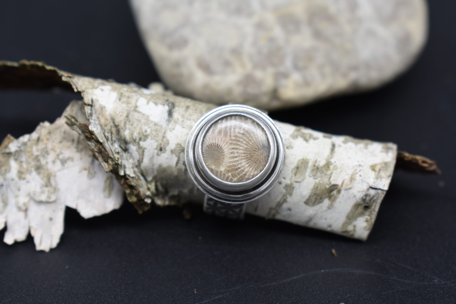 Round Petoskey Stone set in Sterling Silver with a wide textured band Size 5.5