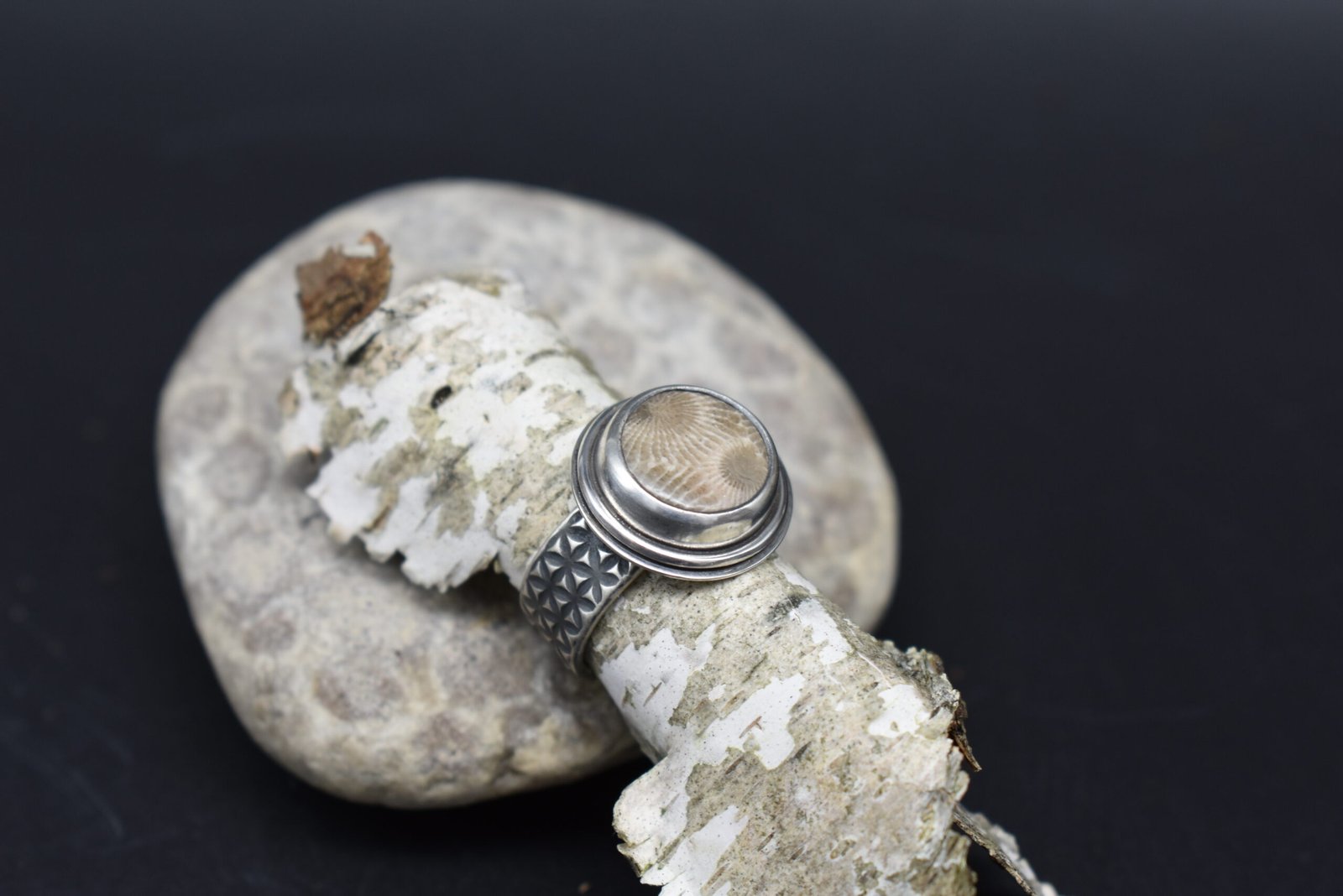 Round Petoskey Stone set in Sterling Silver with a wide textured band Size 5.5