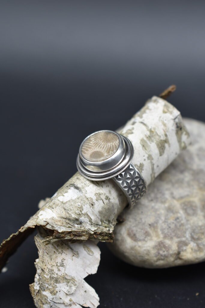 Round Petoskey Stone set in Sterling Silver with a wide textured band Size 5.5
