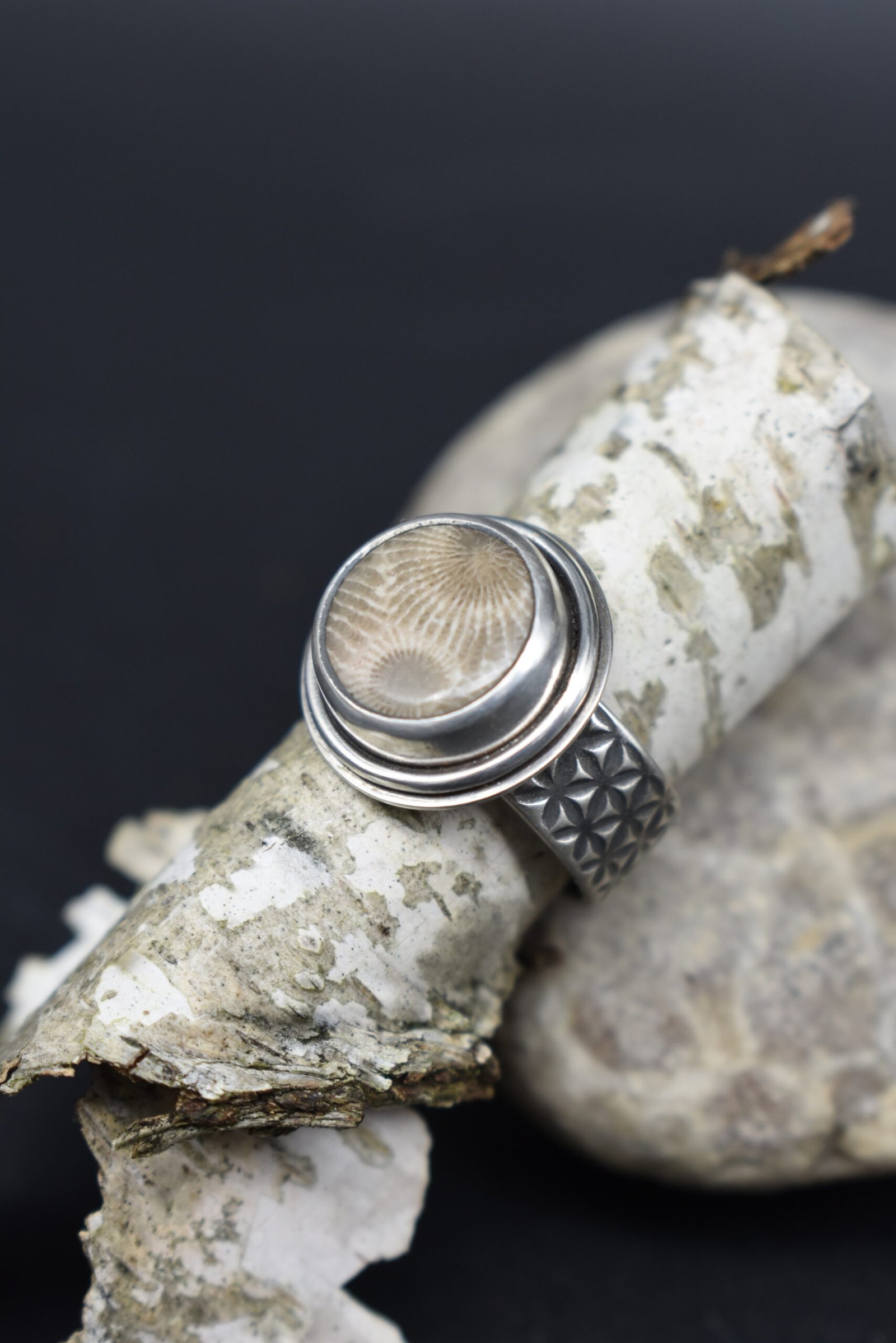 Round Petoskey Stone set in Sterling Silver with a wide textured band Size 5.5